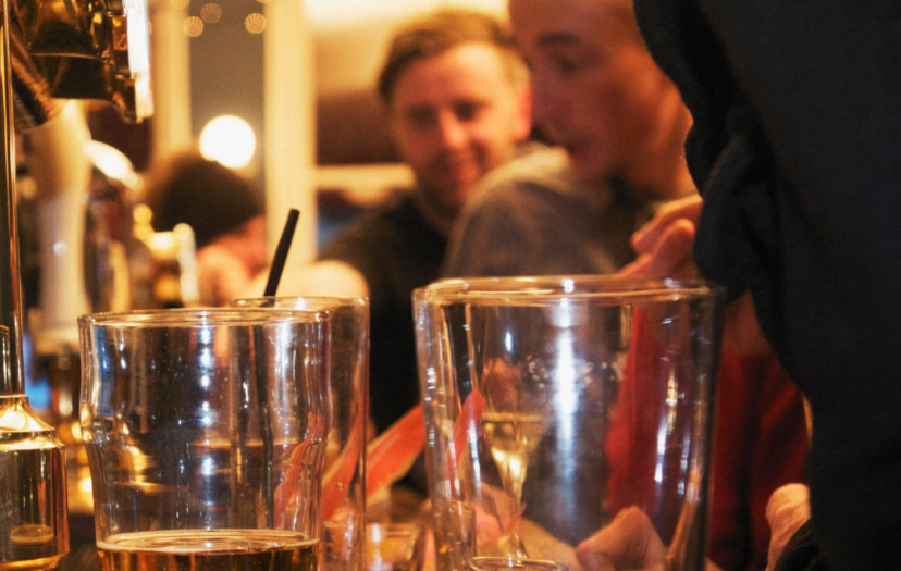 Bar patrons and empty beer glasses